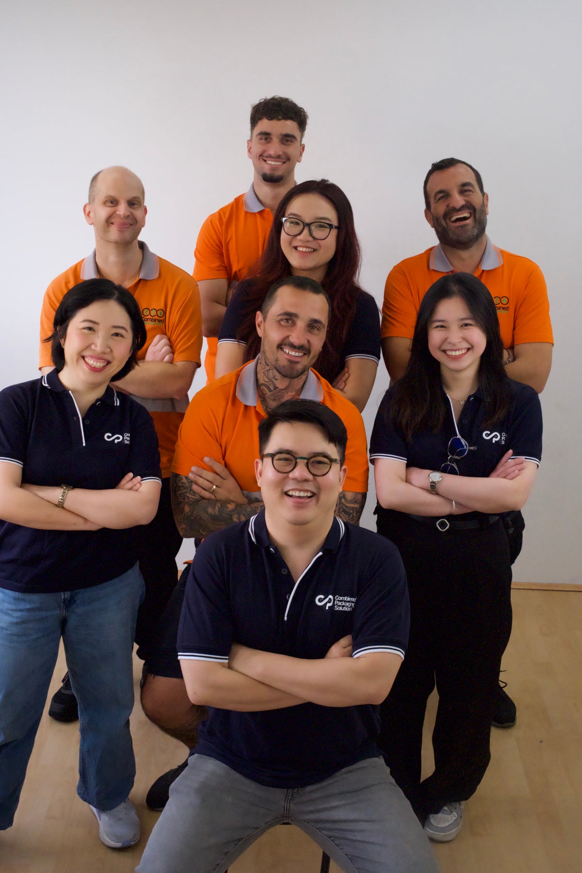 The CPS team, arms crossed and smiling